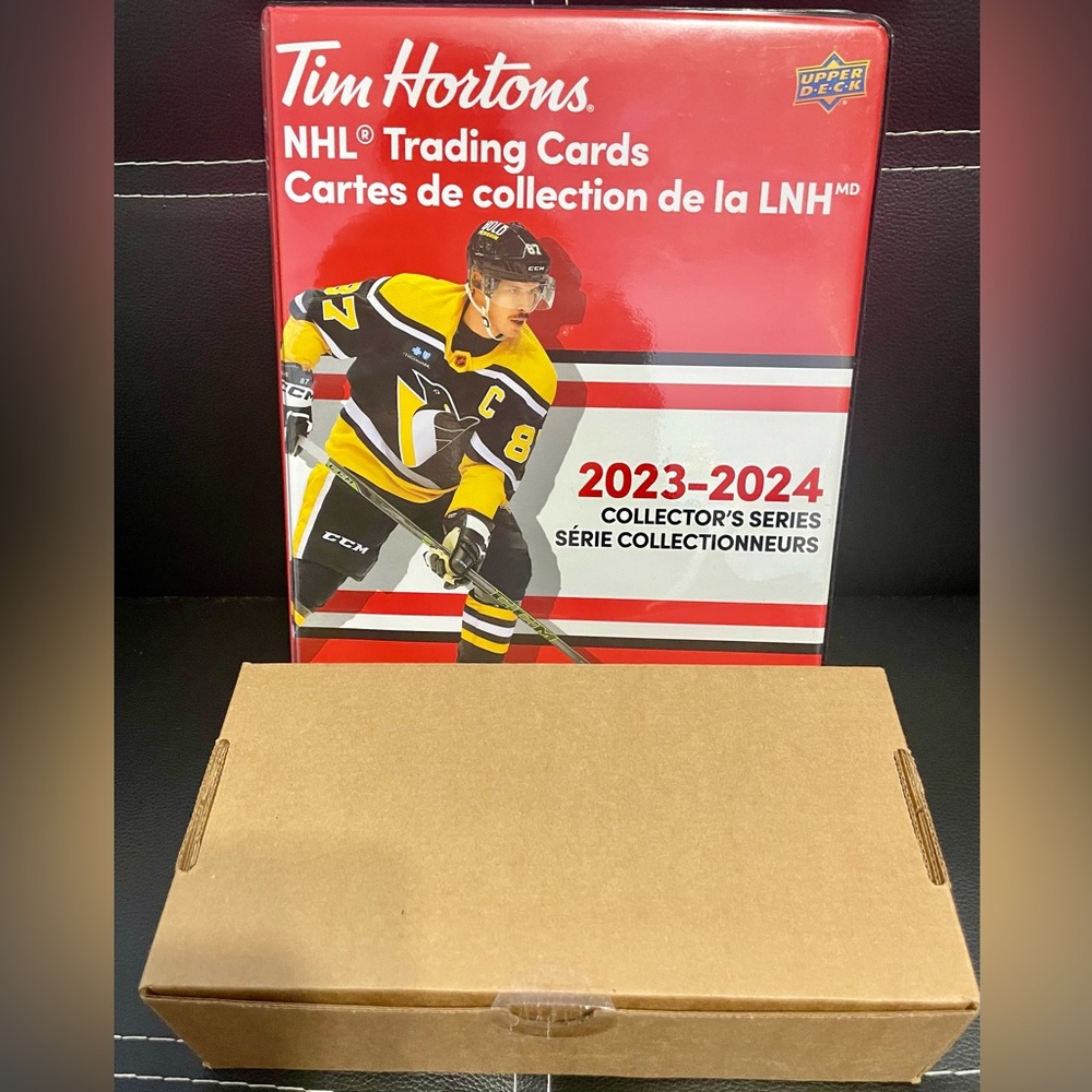 2023-2024 1 full box of hockey cards (sealed/unopened). Comes with album .